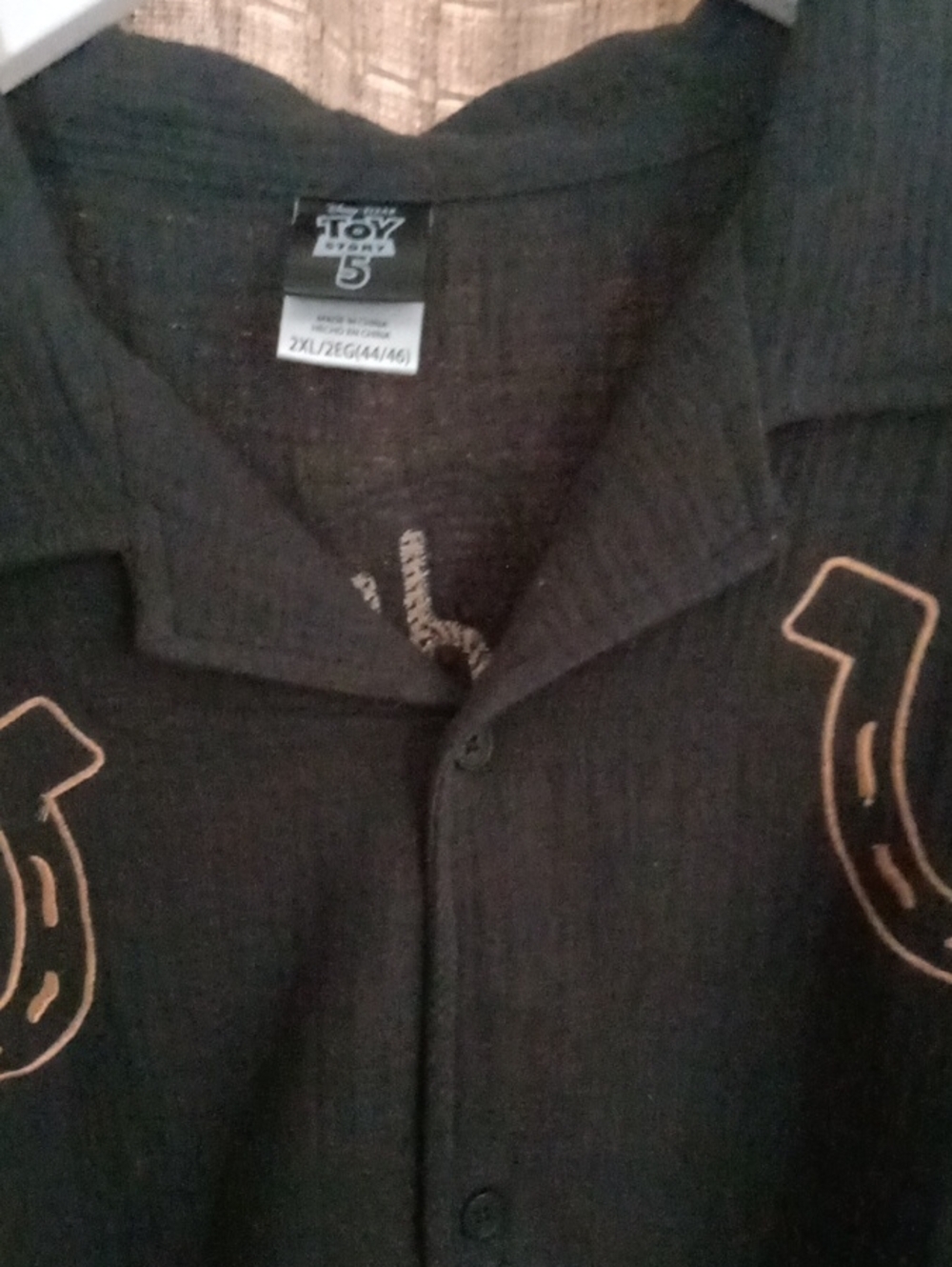 Disney Men’s Black Casual Button-Down Shirt with Orange Horseshoe Accent